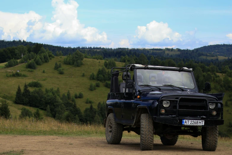 a jeep that is sitting in the dirt