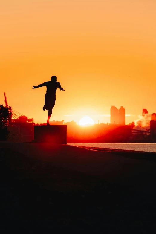 a man riding a skateboard down the side of a sidewalk