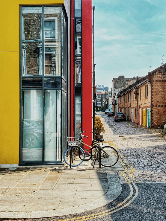 bicycle parked outside a building next to a sidewalk