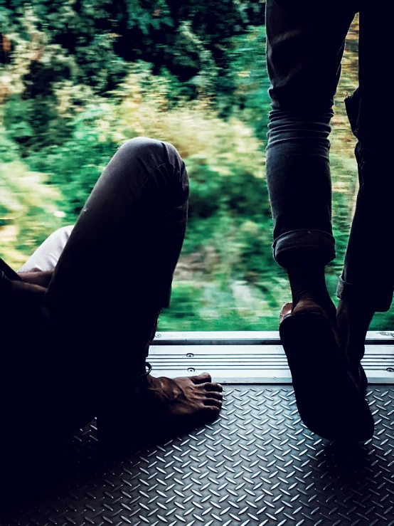 a couple of people standing on a train platform