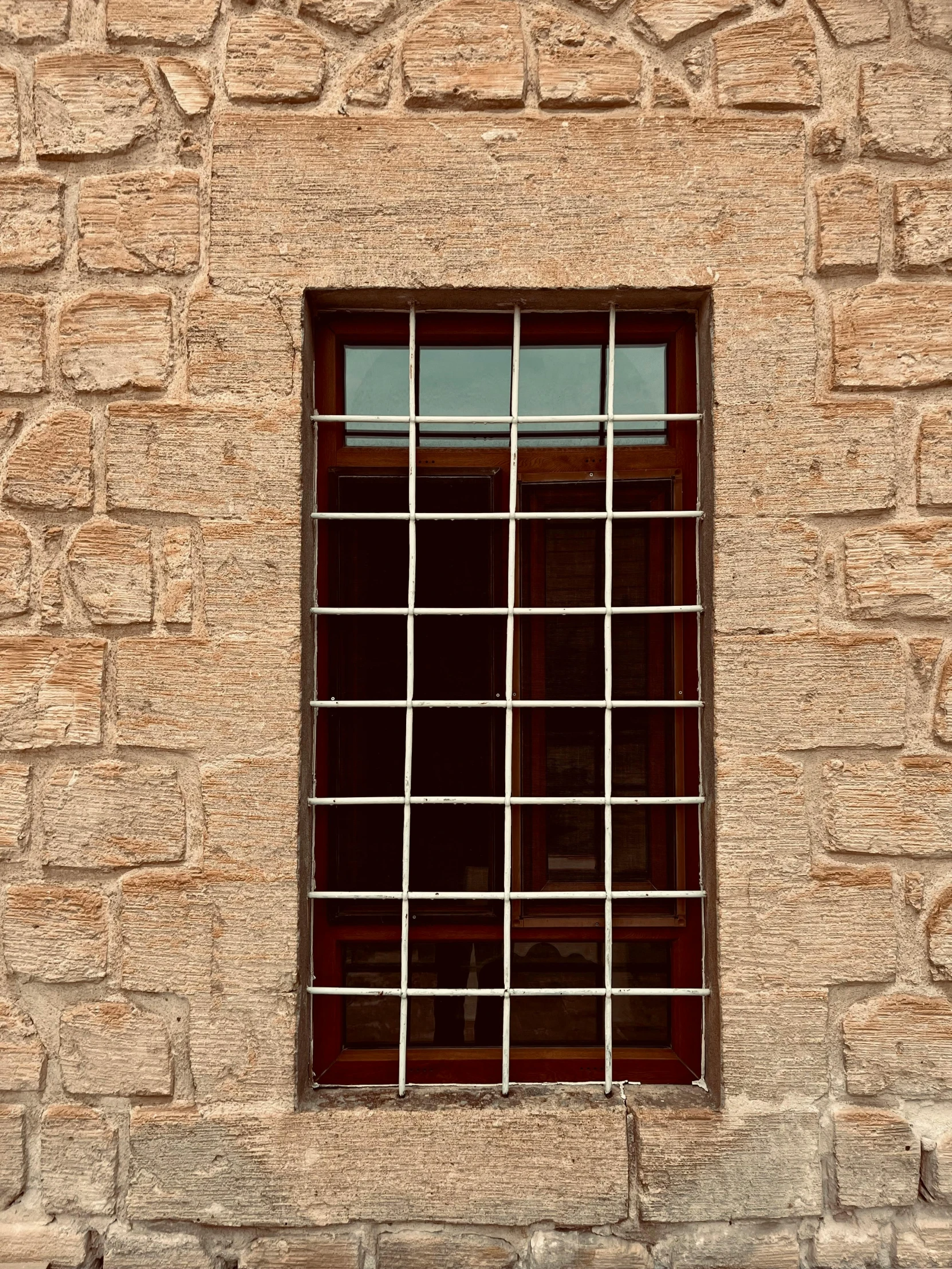 a very old window sitting below some windows