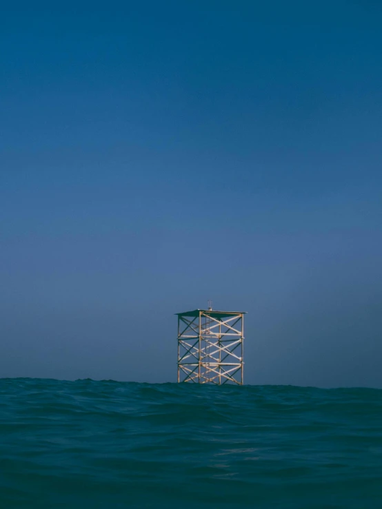 an over head view of some water with a small structure