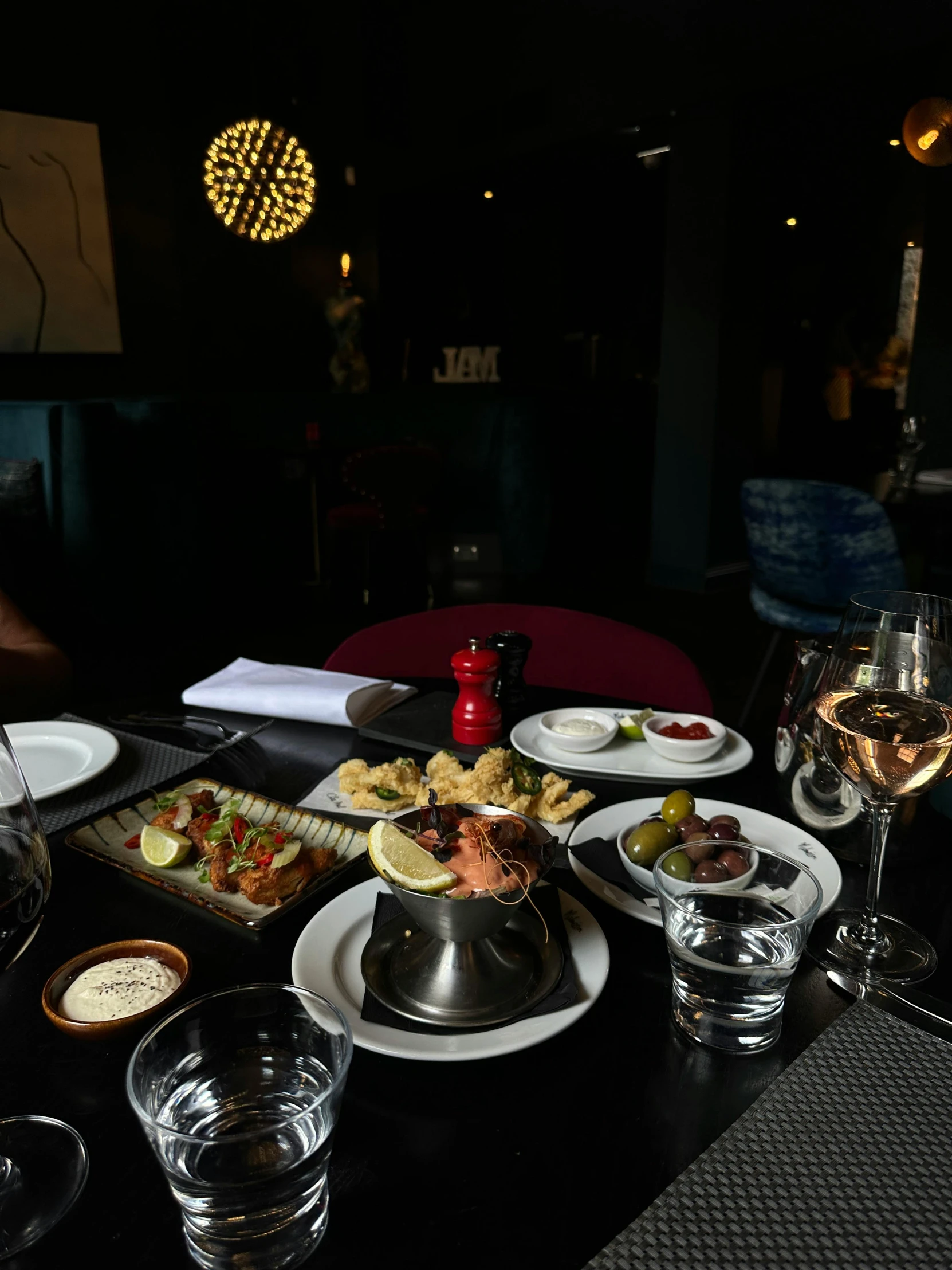 a dining table full of food in various dishes