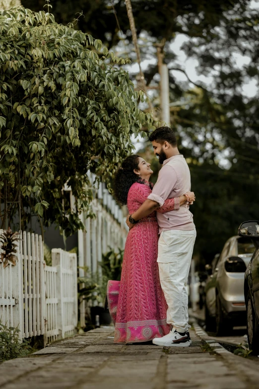 man and woman standing on street holding hands