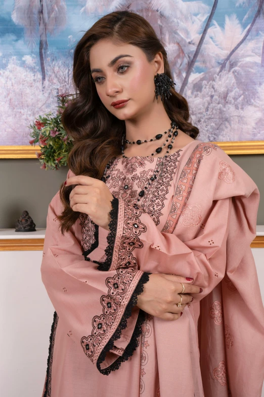 an oriental woman in pink is posing for a po