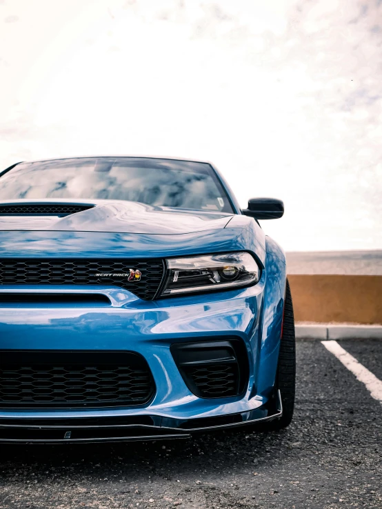 the front grille of a blue pontiac vehicle