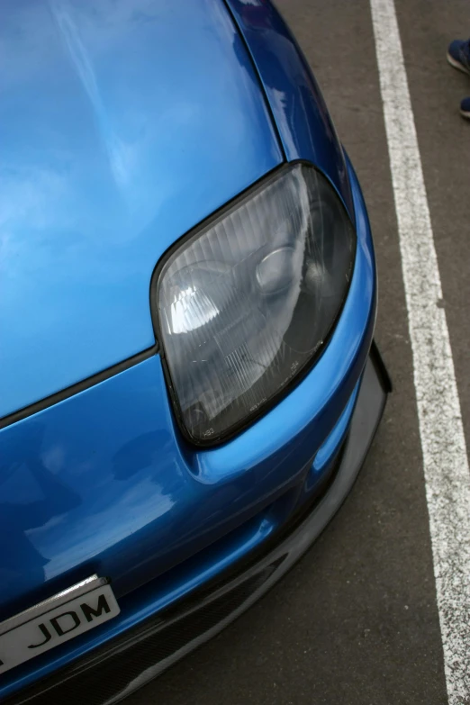 an image of a close up of a blue car