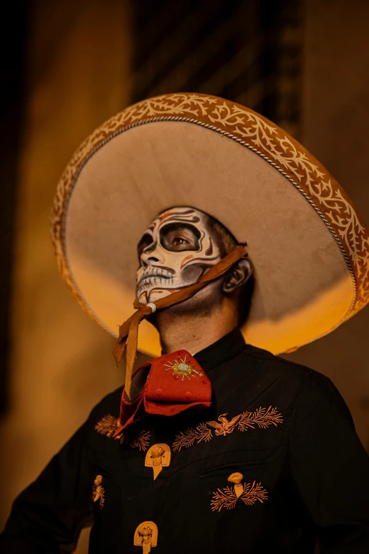 man with painted skull face in top hat, day of the dead celetion