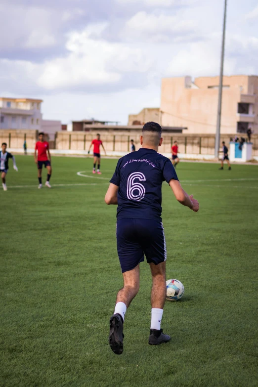 a soccer game showing players kicking the ball around