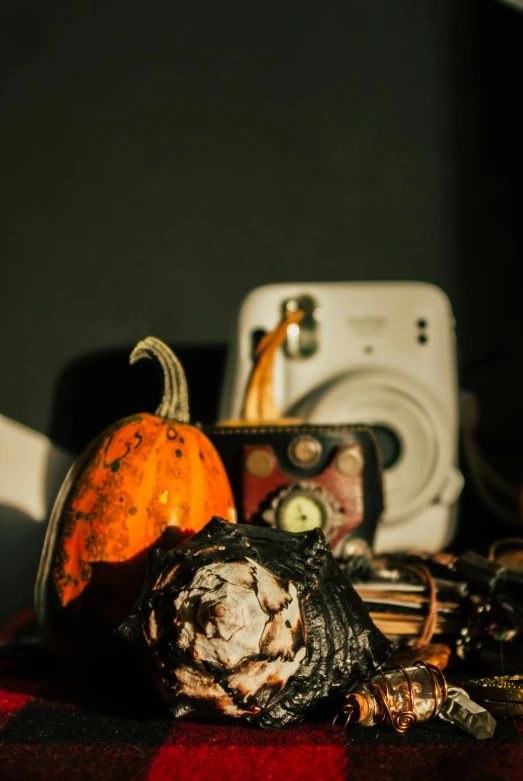 a small assortment of antique decorations including pumpkins