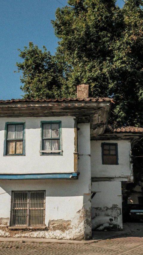 an old building with two floors and one story