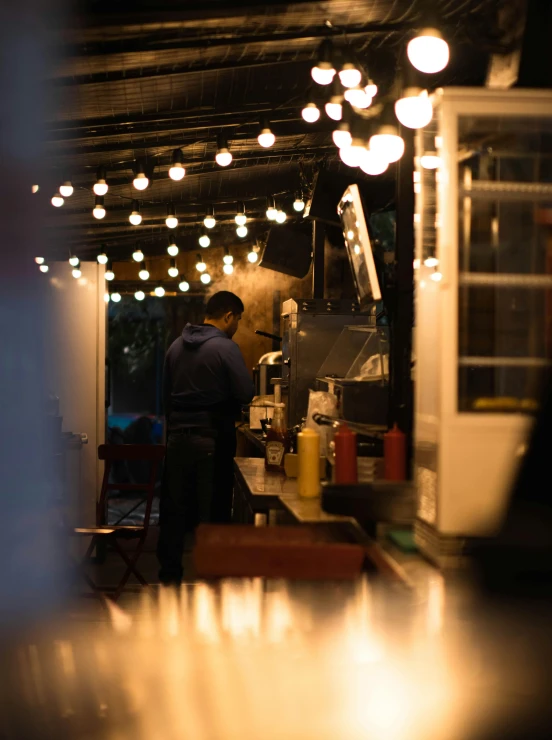 a man working at a counter in a restaurant