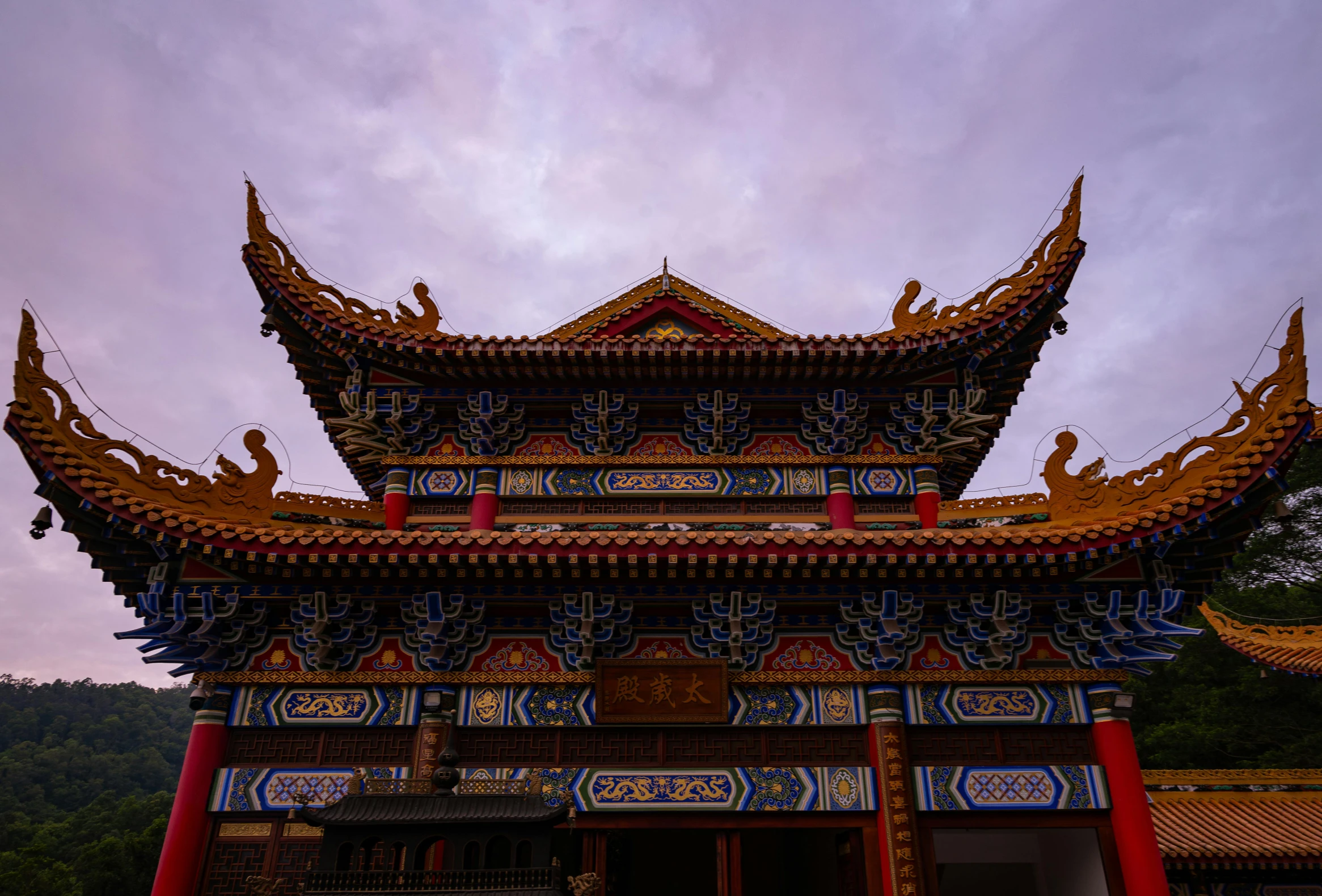 a tall building with lots of chinese architecture on top