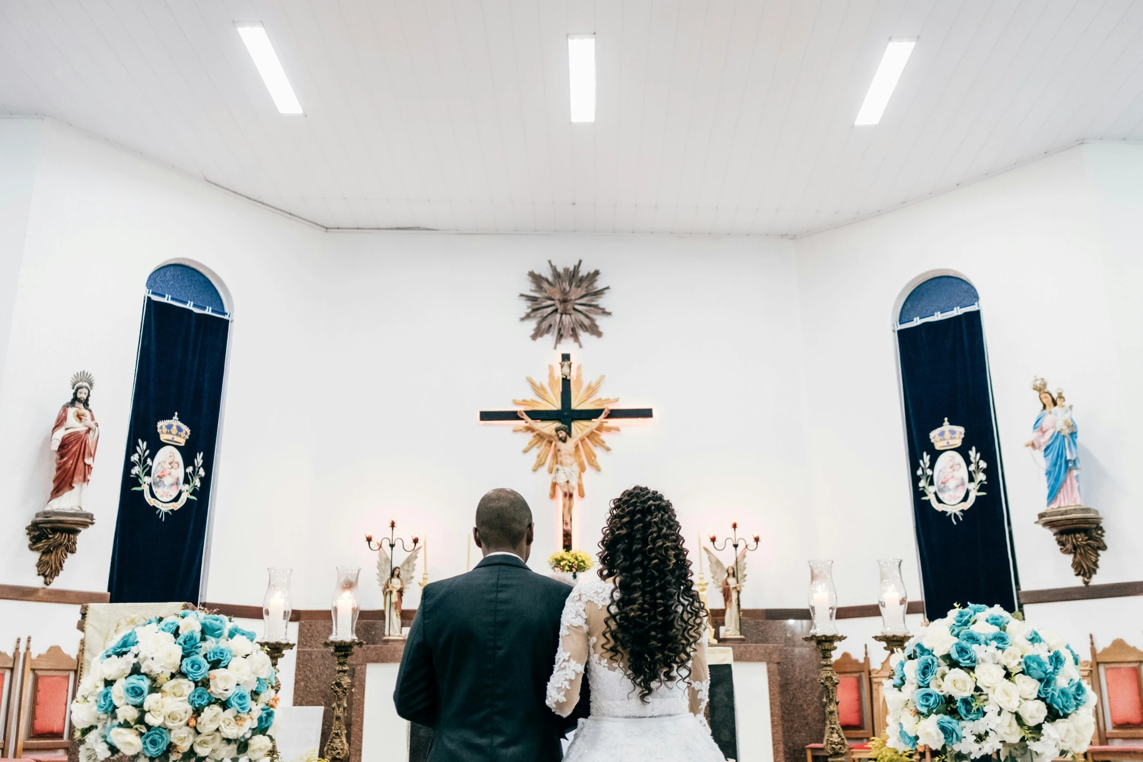 the bride and groom are at the alter before the wedding ceremony