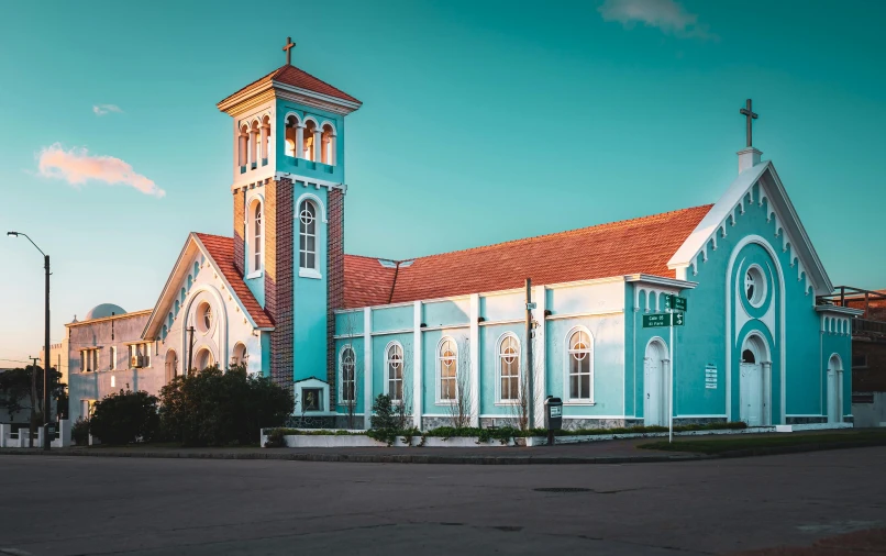 the blue church has a steeple on top