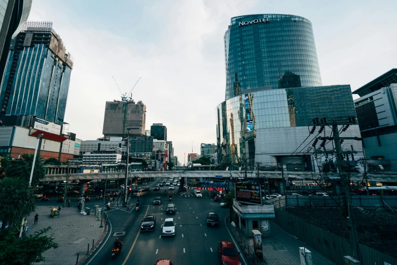 traffic travels down an urban street in the city