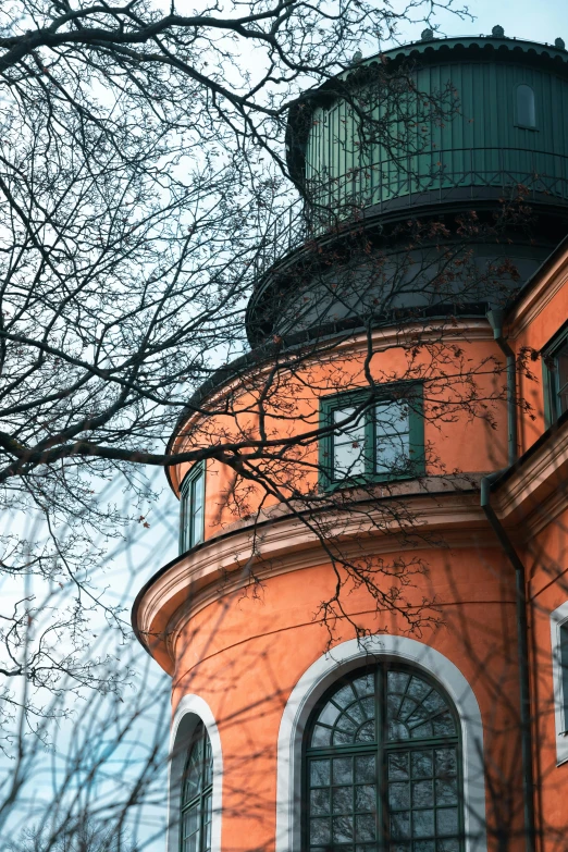 the circular building has two windows on each side of it