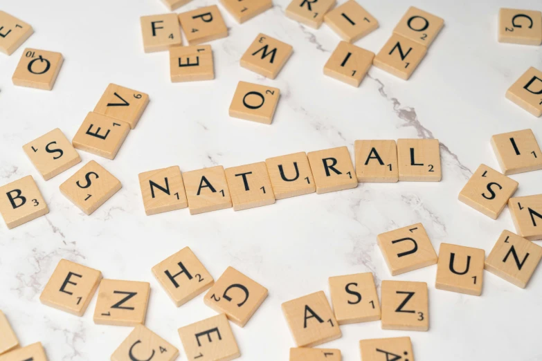 a close up of scrabbles and words spelled with scrabble tiles