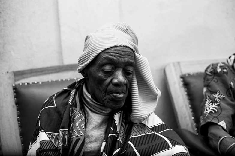 a woman with a knitted hat covering her face