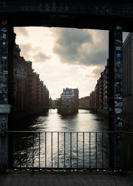 a view of a canal from underneath a bridge