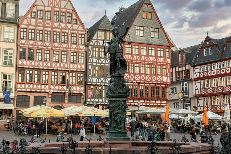 a building with several shops and a fountain