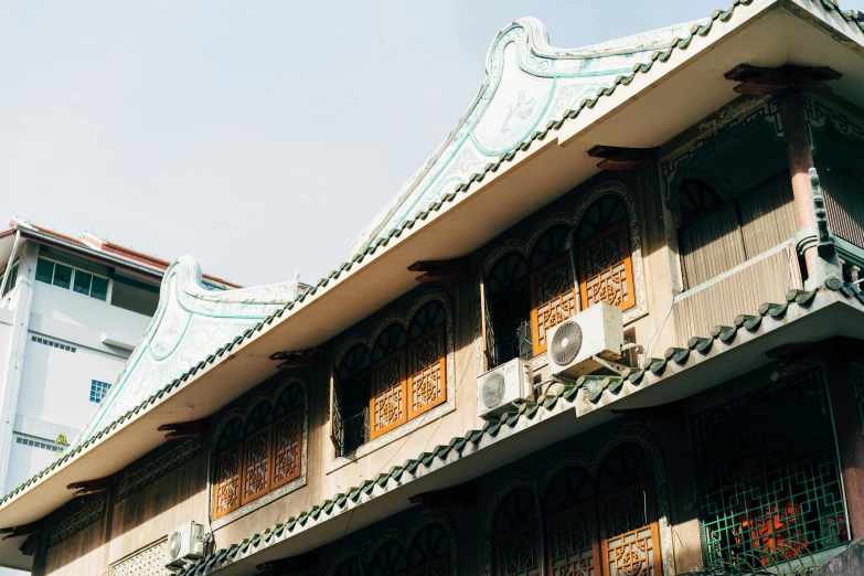 an elaborately carved building in the middle of the day