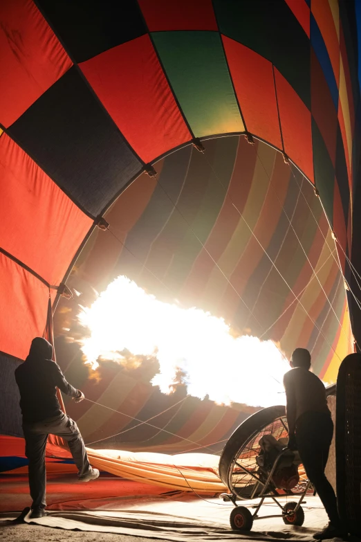 people are near a large colorful  air balloon