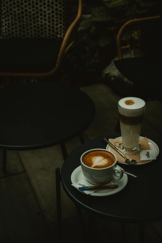 a small round table with some cups on it