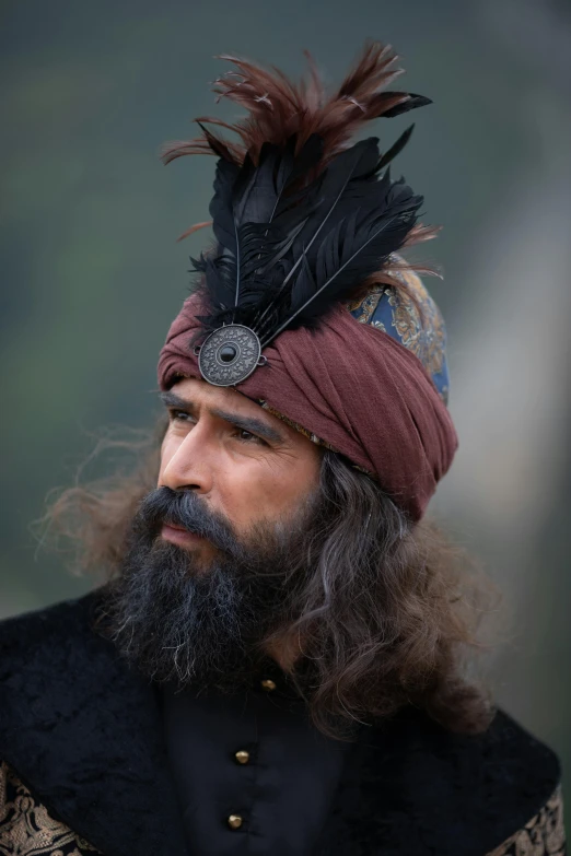 a man with a long beard and a turban on his head