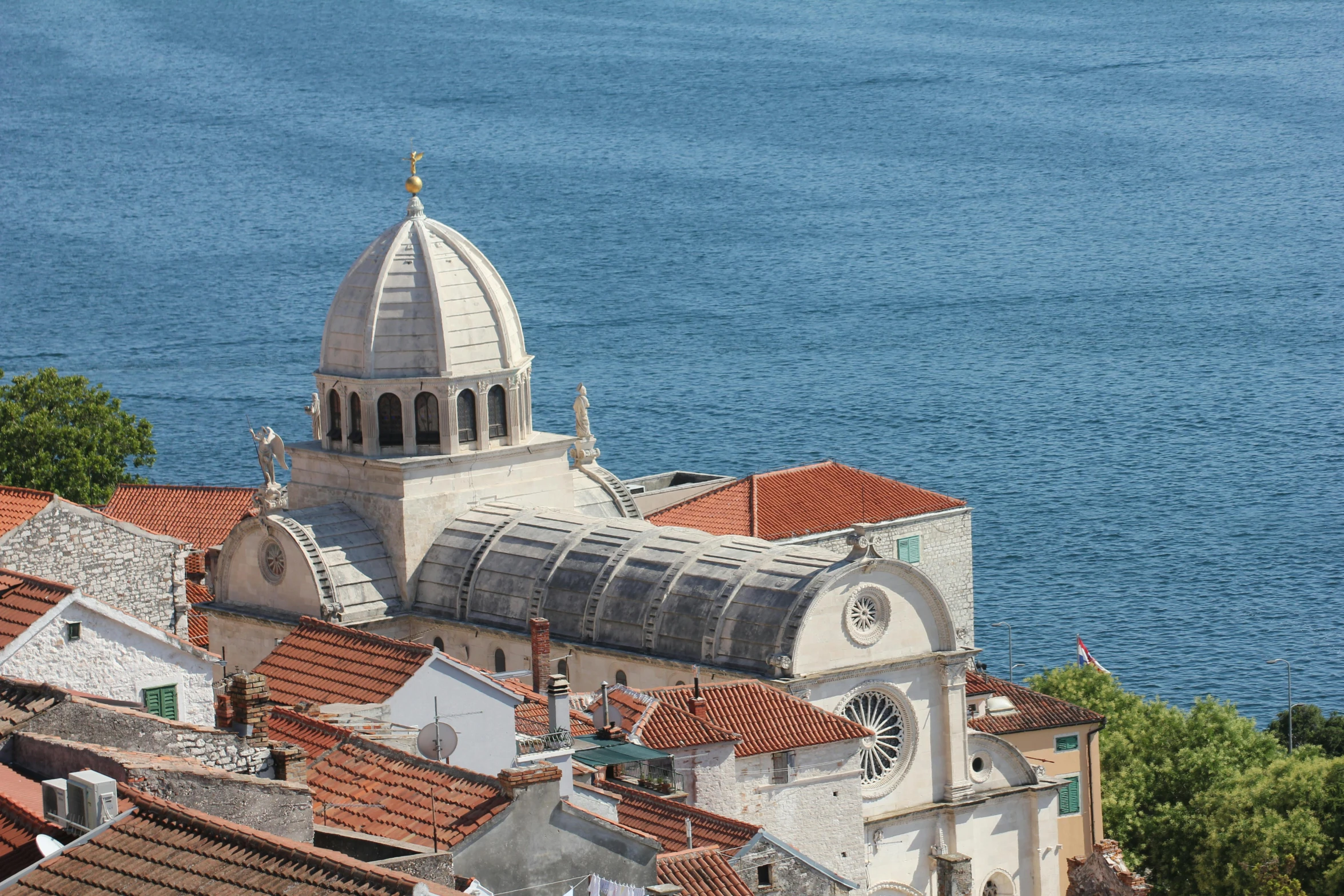 a view of a church that has red roof tops