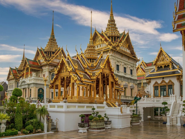 gold colored architecture with several columns around it