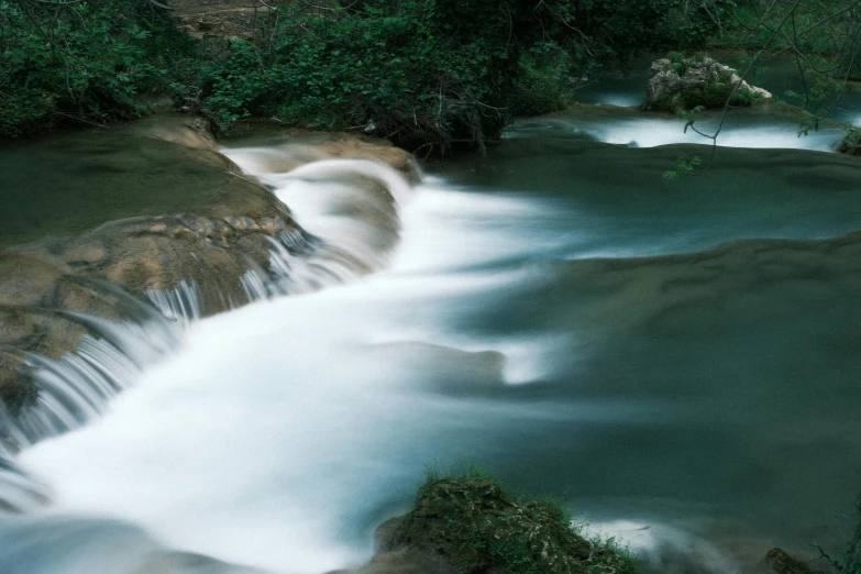 there is a very small waterfall in the jungle