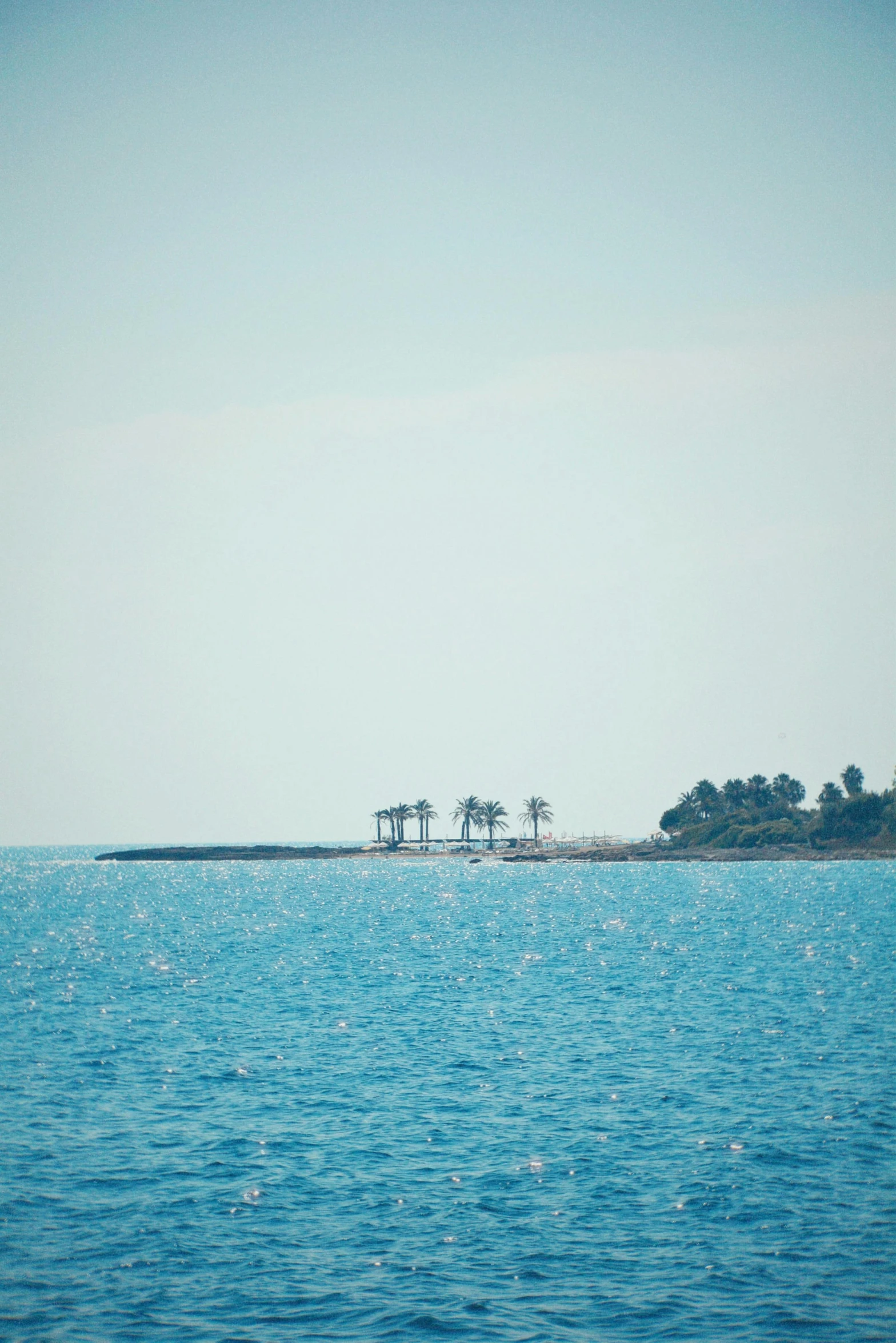 the view of a water way with the island in the distance