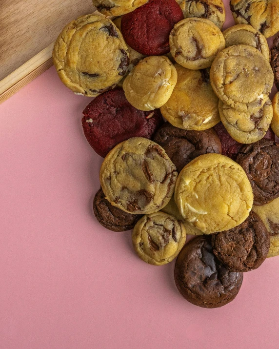 cookies that are on a table near strawberries