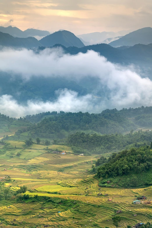 the mountain tops are covered in thick clouds