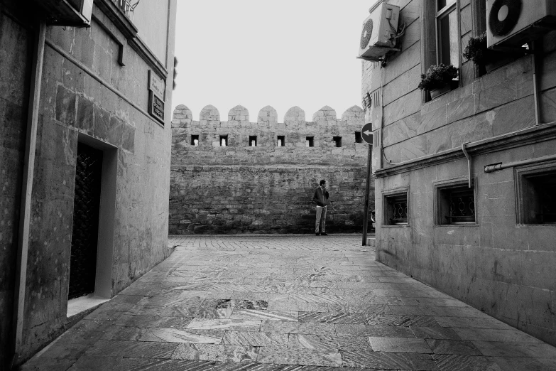 an old building with a person standing in front