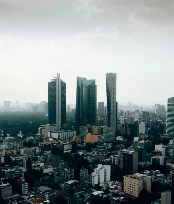 the city skyline is covered in smoggy haze