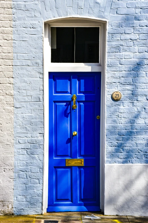 a blue door and window in an old building