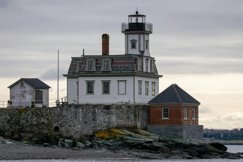 a tower sits on top of an ocean cliff