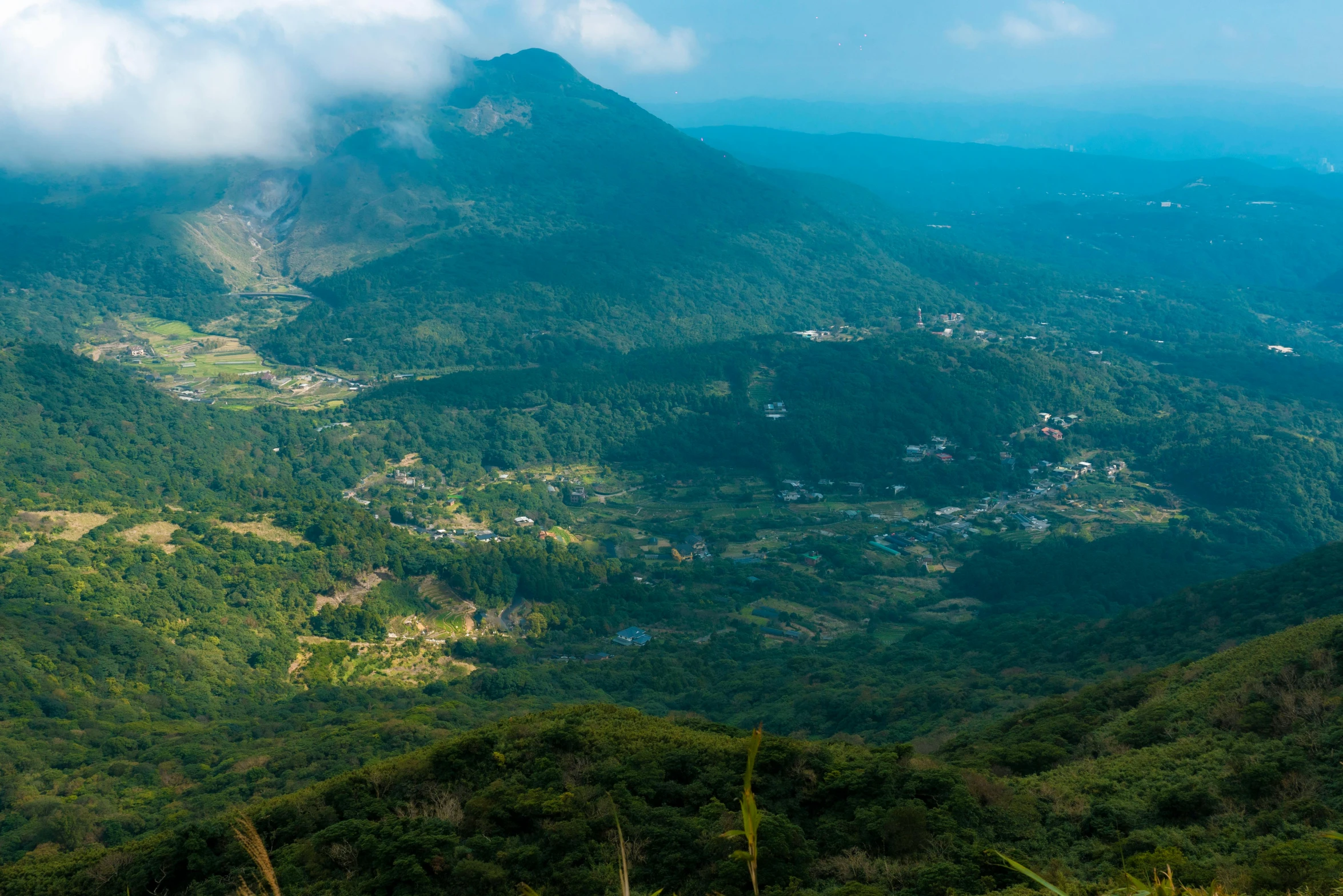 an expansive forested, mountainous area in the far distance