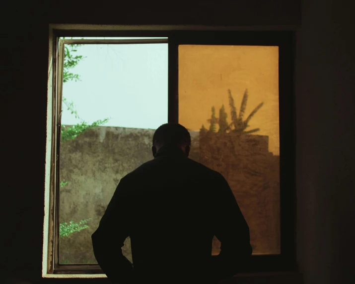 a person standing in front of an open window