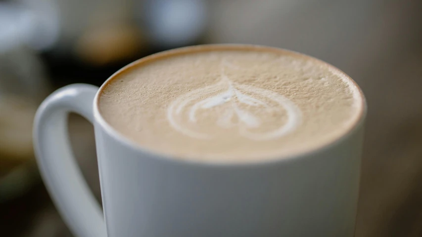 a closeup view of a coffee cup on a table