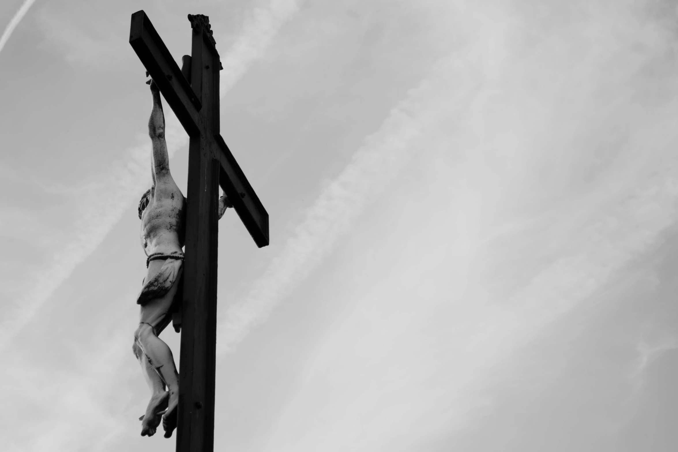 a cross with a man on it hanging from it