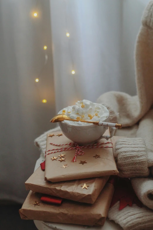 a white bowl of food sitting on top of two packages