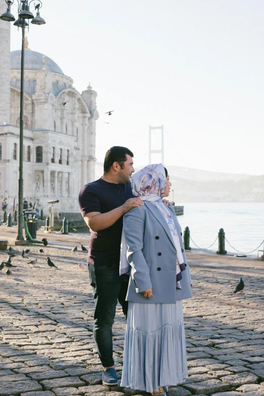 a man is taking a po with his pregnant mother