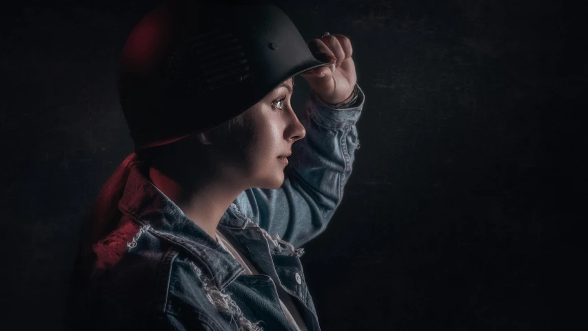 a person holding their hat and staring out over the top of his head