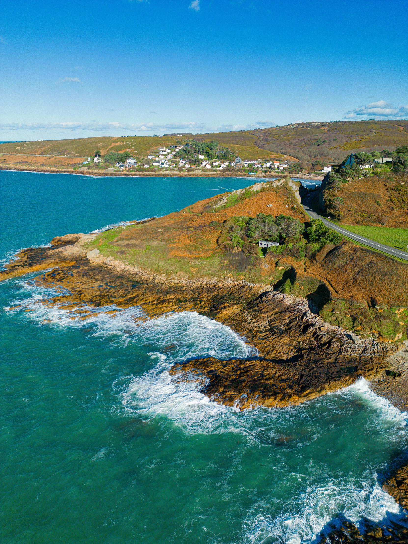 an aerial view of a rocky cliff on a clear day