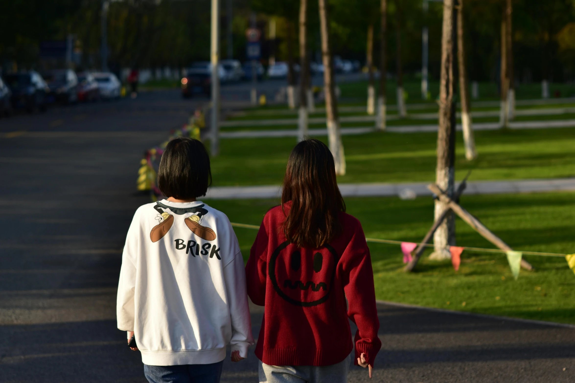 two people walking on the street