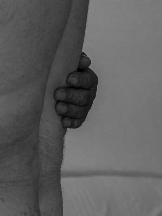 a close - up of a male hand holding soing