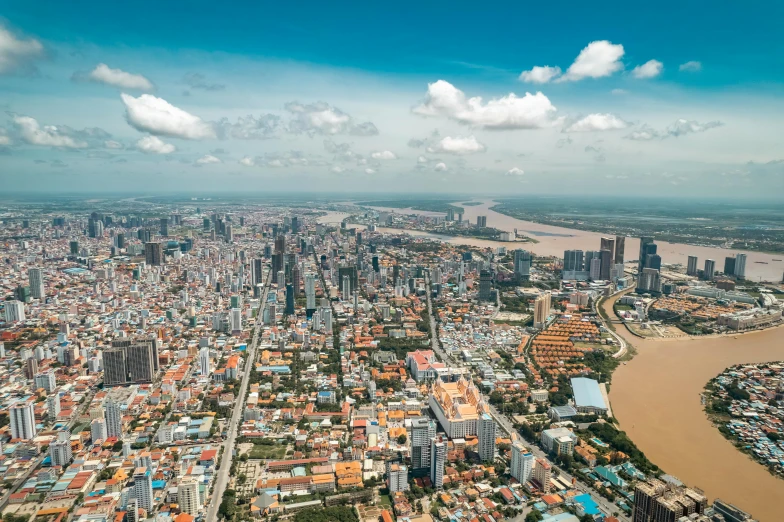 a large city next to the ocean is shown from the air